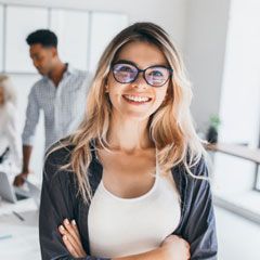 Woman with glasses smiling