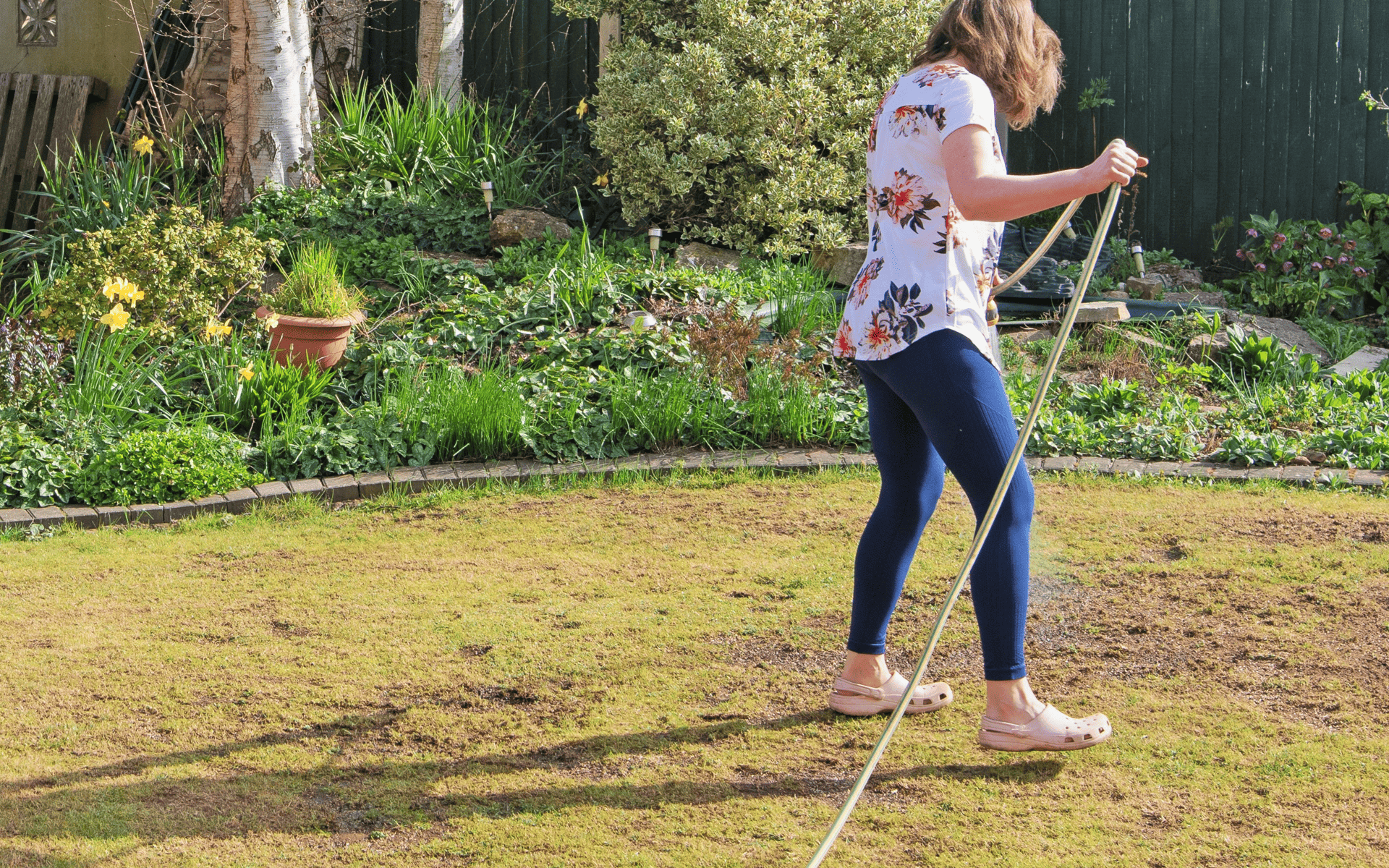 Australian Lawn Care - Lady applying lawn care product