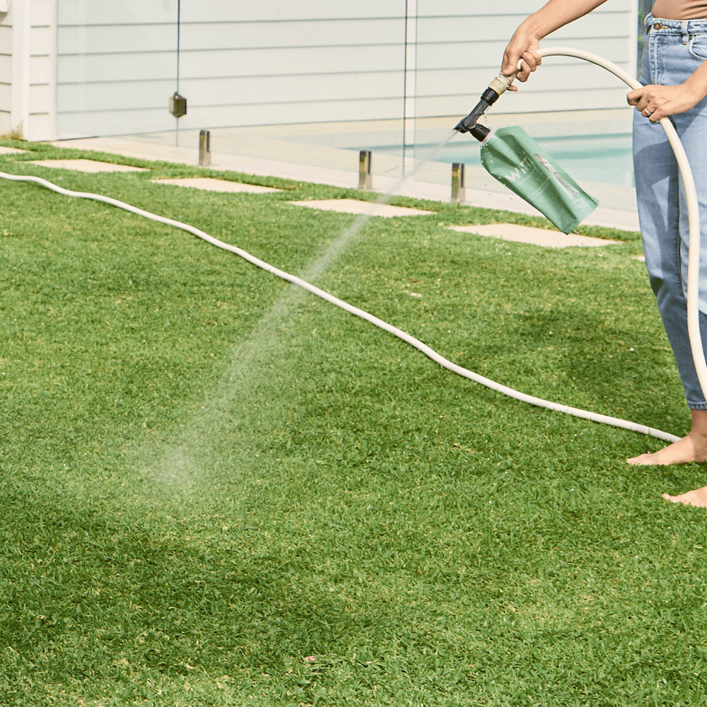 Australian Lawn Care - Lady using a lawn care product